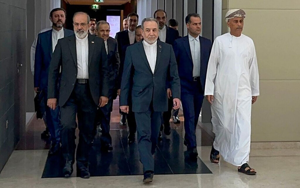 In this handout photo obtained from Iran's foreign ministry on February 6, 2026, Iran's Foreign Minister Abbas Araghchi (C) arrives for a meeting in Muscat, Oman. (IRAN FOREIGN MINISTRY / AFP)