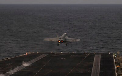 In this handout photograph released by the US Navy on February 5, 2026, an F/A-18E Super Hornet, attached to Strike Fighter Squadron (VFA) 14, launches from the flight deck of Nimitz-class aircraft carrier USS Abraham Lincoln in the Arabian Sea on February 3, 2026. (Zoe Simpson/US Navy/AFP) In this handout photograph released by the US Navy on February 5, 2026, an F/A-18E Super Hornet, attached to Strike Fighter Squadron (VFA) 14, launches from the flight deck of Nimitz-class aircraft carrier USS Abraham Lincoln in the Arabian Sea on February 3, 2026. (Zoe Simpson/US Navy/AFP)