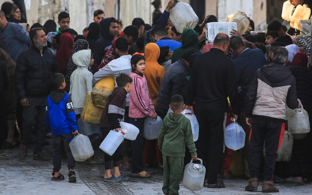 Displaced Palestinians wait to fill jerrycans with water collected from a desalination plant in Khan Younis, southern Gaza Strip, on February 7, 2026. (Bashar Taleb/AFP) Displaced Palestinians wait to fill jerrycans with water collected from a desalination plant in Khan Younis, southern Gaza Strip, on February 7, 2026. (Bashar Taleb/AFP)