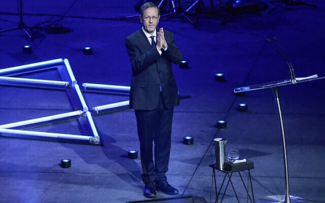 President Isaac Herzog gestures after delivering a speech as he participates in an event titled 'An Evening of Light and Solidarity' for the victims of the December 14, 2025 gun attack in Sydney on February 9, 2026. (Photo by DAVID GRAY / AFP) President Isaac Herzog gestures after delivering a speech as he participates in an event titled 'An Evening of Light and Solidarity' for the victims of the December 14, 2025 gun attack in Sydney on February 9, 2026. (Photo by DAVID GRAY / AFP)
