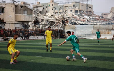 Palestinians take part in a five-a-side football match amid the rubble of destroyed buildings in Gaza City on February 9, 2026. (Omar A-Qattaa/AFP) Palestinians take part in a five-a-side football match amid the rubble of destroyed buildings in Gaza City on February 9, 2026. (Omar A-Qattaa/AFP)