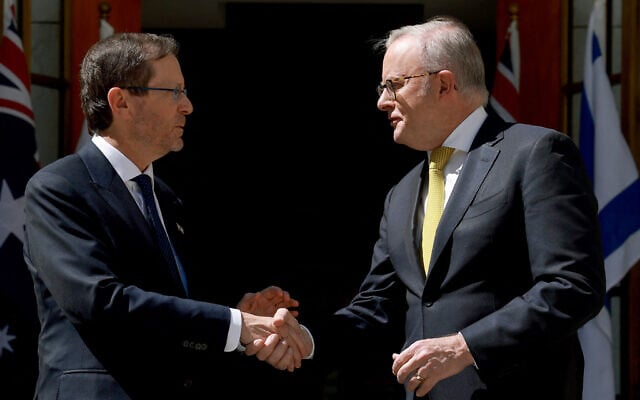 Australia's Prime Minister Anthony Albanese (R) receives President Isaac Herzog at the Parliament House in Canberra on February 11, 2026. (Photo by DAVID GRAY / AFP) Australia's Prime Minister Anthony Albanese (R) receives President Isaac Herzog at the Parliament House in Canberra on February 11, 2026. (Photo by DAVID GRAY / AFP)
