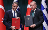 Turkish President Recep Tayyip Erdogan (R) and Greek Prime Minister Kyriakos Mitsotakis (L) pose after a signing ceremony following a meeting of Turkey/Greek High-Level Cooperation Council at the Presidential Complex in Ankara, Turkey, on February 11, 2026. (Adem ALTAN / AFP)
