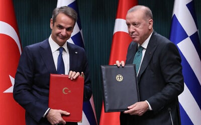 Turkish President Recep Tayyip Erdogan (R) and Greek Prime Minister Kyriakos Mitsotakis (L) pose after a signing ceremony following a meeting of Turkey/Greek High-Level Cooperation Council at the Presidential Complex in Ankara, Turkey, on February 11, 2026. (Adem ALTAN / AFP)