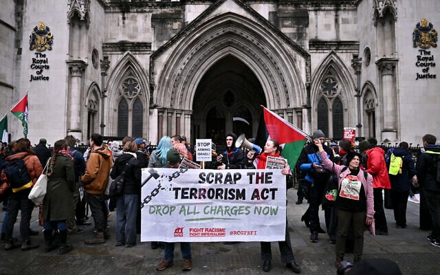 Anti-Israel protesters hold a banner in support of the Palestine Action group outside The Royal Courts of Justice, Britain's High Court, in London on February 13, 2026. (Ben STANSALL / AFP) Anti-Israel protesters hold a banner in support of the Palestine Action group outside The Royal Courts of Justice, Britain's High Court, in London on February 13, 2026. (Ben STANSALL / AFP)