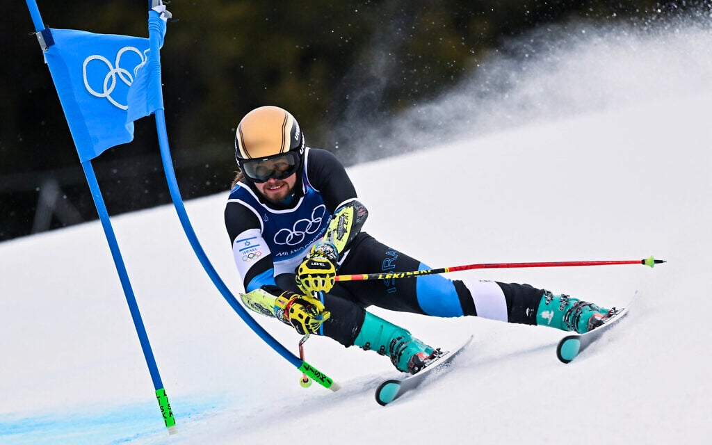 Israel's Barnabas Szollos passes a gate in the first run of the men's giant slalom alpine skiing event during the Milano Cortina 2026 Winter Olympic Games at the Stelvio Ski Centre in Bormio (Valtellina) on February 14, 2026 (Fabrice COFFRINI / AFP)