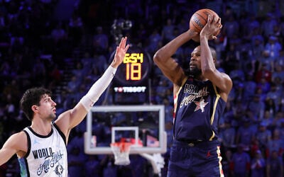 Kevin Durant of Team USA Stripes (R) shoots against Deni Avdija of Team World during the 75th NBA All-Star Game at Intuit Dome on February 15, 2026 in Inglewood, California. (Ronald Martinez/Getty Images/AFP)