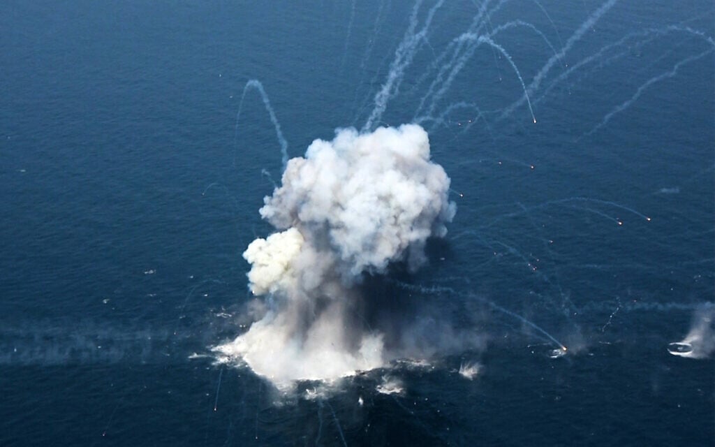 This handout photo released by the Islamic Revolutionary Guard Corps of Iran's official website Sepanews on February 17, 2026, shows an explosion during a military exercise by members of the IRGC and navy in the Strait of Hormuz. (Sepah News/AFP)