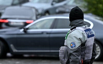 A Swiss police officer stands as diplomatic delegation cars arrive outside the hotel for a second day of US-mediated talks with Russia and Ukraine seeking to find an end to the four-year war, in Geneva on February 18, 2026 (Harold CUNNINGHAM / AFP) A Swiss police officer stands as diplomatic delegation cars arrive outside the hotel for a second day of US-mediated talks with Russia and Ukraine seeking to find an end to the four-year war, in Geneva on February 18, 2026 (Harold CUNNINGHAM / AFP)