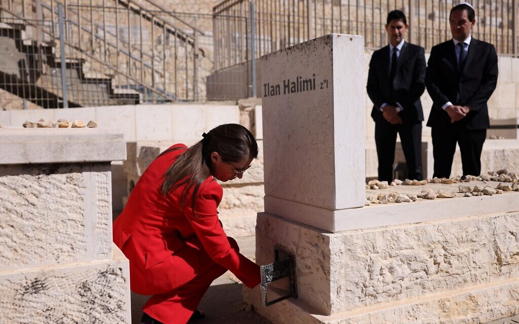 French Minister for the Fight against Discrimination Aurore Berge places a candle as she visits the grave of French Jewish man Ilan Halimi, murdered in an antisemitic attack in Paris in 2006, at the Givat Shaul cemetery, in Jerusalem on February 18, 2026 (Ilia YEFIMOVICH / AFP) French Minister for the Fight against Discrimination Aurore Berge places a candle as she visits the grave of French Jewish man Ilan Halimi, murdered in an antisemitic attack in Paris in 2006, at the Givat Shaul cemetery, in Jerusalem on February 18, 2026 (Ilia YEFIMOVICH / AFP)