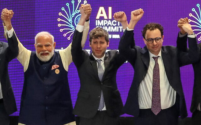 India's Prime Minister Narendra Modi (left) takes a group photo with AI company leaders including OpenAI CEO Sam Altman (center) and Anthropic CEO Dario Amodei (right) at the AI Impact Summit in New Delhi on February 19, 2026. (Ludovic MARIN / AFP) India's Prime Minister Narendra Modi (left) takes a group photo with AI company leaders including OpenAI CEO Sam Altman (center) and Anthropic CEO Dario Amodei (right) at the AI Impact Summit in New Delhi on February 19, 2026. (Ludovic MARIN / AFP)