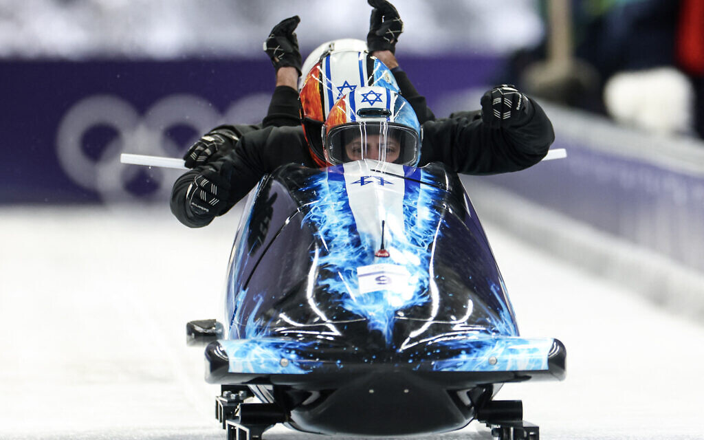 Israel's AJ Edelman pilots in the bobsleigh men's 4-man training session heat 3 at Cortina Sliding Center during the Milano Cortina 2026 Winter Olympic Games in Cortina d'Ampezzo on February 19, 2026. (FRANCK FIFE / AFP)