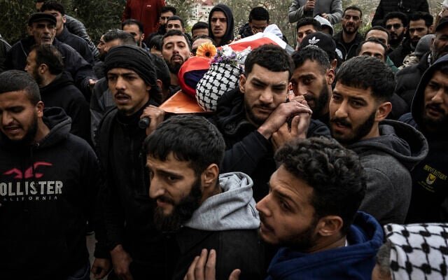 Mourners carry the body of Palestinian-American Nasrallah Muhammad Abu Siam, 19, February 19, 2026, who was allegedly shot by settlers, during his funeral in the West Bank village of Mukhmas, east of Ramallah. (Photo by JOHN WESSELS / AFP) Mourners carry the body of Palestinian-American Nasrallah Muhammad Abu Siam, 19, February 19, 2026, who was allegedly shot by settlers, during his funeral in the West Bank village of Mukhmas, east of Ramallah. (Photo by JOHN WESSELS / AFP)