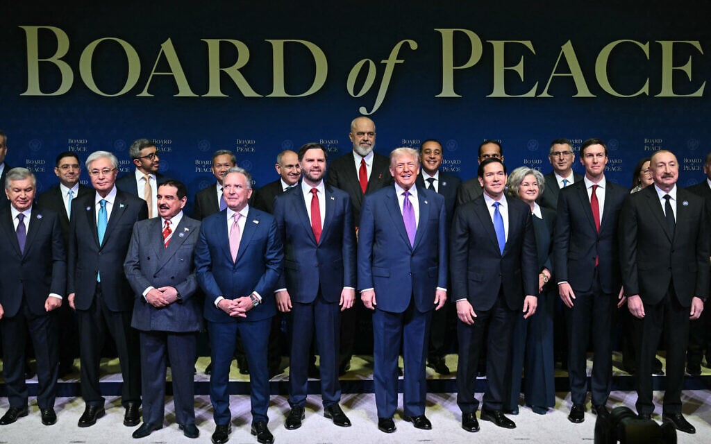 US President Donald Trump (C), flanked by US Vice President JD Vance (L) and US Secretary of State Marco Rubio (R), joins leaders for a group photo during the inaugural meeting of the Board of Peace at the US Institute of Peace in Washington, DC, on February 19, 2026. (SAUL LOEB / AFP)