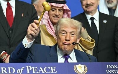 US President Donald Trump holds a gavel during a signing ceremony at the inaugural meeting of the "Board of Peace" at the US Institute of Peace in Washington, DC, on February 19, 2026. (SAUL LOEB / AFP)