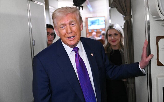 US President Donald Trump speaks to reporters on Air Force One before taking off from Joint Base Andrews, Maryland, on February 19, 2026. (SAUL LOEB / AFP)