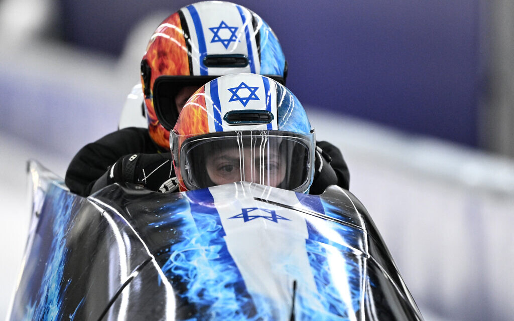 Team Israel including pilot Israel's Adam Edelman (bottom C) take part in the bobsleigh men's 4-man training session at Cortina Sliding Centre during the Milano Cortina 2026 Winter Olympic Games in Cortina d'Ampezzo on February 20, 2026. (Tiziana FABI / AFP) Team Israel including pilot Israel's Adam Edelman (bottom C) take part in the bobsleigh men's 4-man training session at Cortina Sliding Centre during the Milano Cortina 2026 Winter Olympic Games in Cortina d'Ampezzo on February 20, 2026. (Tiziana FABI / AFP)