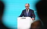 German Chancellor and leader of Germany's Christian Democratic Union (CDU) Friedrich Merz gives a speech during his CDU's party congress in Stuttgart, southern Germany, February 20, 2026. (Thomas Kienzle / AFP)