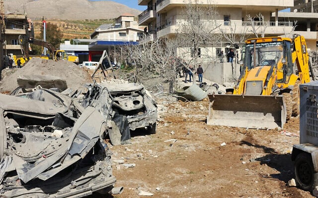 A bulldozer clears debris near heavily damaged buildings in the village of Bednayel in Lebanon's eastern Bekaa Valley region on February 21, 2026, following Israeli strikes. (AFP) A bulldozer clears debris near heavily damaged buildings in the village of Bednayel in Lebanon's eastern Bekaa Valley region on February 21, 2026, following Israeli strikes. (AFP)