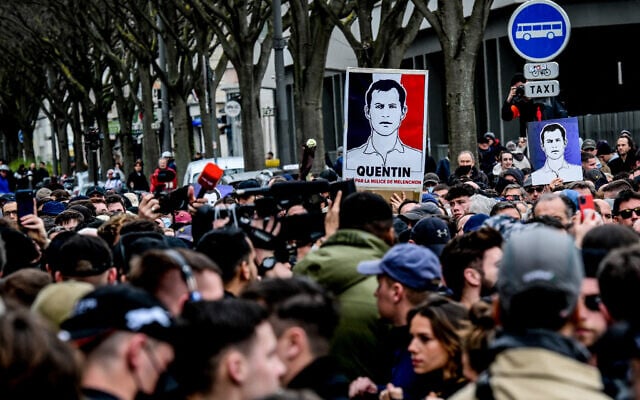 Protesters hold portraits of far-right activist Quentin Deranque during a march in tribute to Quentin Deranque, who died after being attacked on the sidelines of a far-right protest against a La France Insoumise (LFI) event at Sciences Po Lyon, in Lyon on February 21, 2026. (OLIVIER CHASSIGNOLE / AFP) Protesters hold portraits of far-right activist Quentin Deranque during a march in tribute to Quentin Deranque, who died after being attacked on the sidelines of a far-right protest against a La France Insoumise (LFI) event at Sciences Po Lyon, in Lyon on February 21, 2026. (OLIVIER CHASSIGNOLE / AFP)