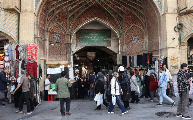 Iranians shop at Tehran's Grand Bazaar on February 24, 2026. (Photo by AFP) Iranians shop at Tehran's Grand Bazaar on February 24, 2026. (Photo by AFP)