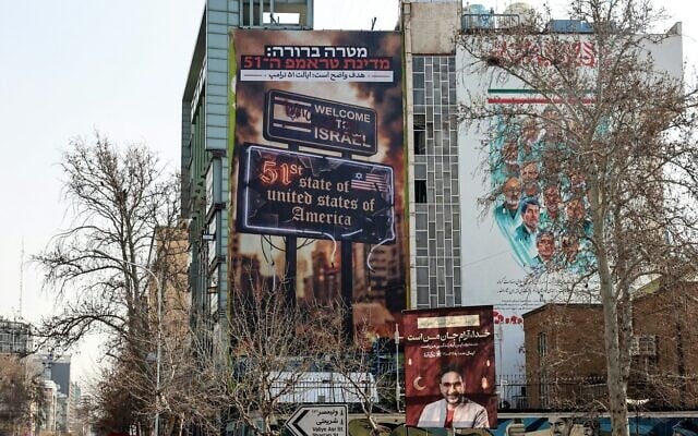 Vehicles drive past an anti-Israel and anti-US billboard hanging from a building that reads 'The target is clear: Trump's 51st state' on Palestine Square in Tehran on February 25, 2026. (ATTA KENARE / AFP) Vehicles drive past an anti-Israel and anti-US billboard hanging from a building that reads 'The target is clear: Trump's 51st state' on Palestine Square in Tehran on February 25, 2026. (ATTA KENARE / AFP)