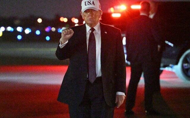 US President Donald Trump makes a fist after he steps off Air Force One upon arrival at Palm Beach International Airport in West Palm Beach, Florida on February 27, 2026. Trump is spending the weekend at his Mar-a-Lago resort. (Photo by Mandel NGAN / AFP) US President Donald Trump makes a fist after he steps off Air Force One upon arrival at Palm Beach International Airport in West Palm Beach, Florida on February 27, 2026. Trump is spending the weekend at his Mar-a-Lago resort. (Photo by Mandel NGAN / AFP)