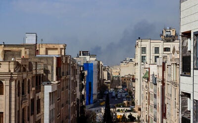 A plume of smoke rises following a reported explosion in Tehran on February 28, 2026 as the US and Israel announce the start of strikes (AFP)