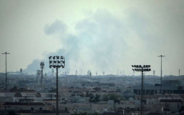 Smoke rises from an area in the direction of Al Udeid Air Base, which houses the Qatar Emiri Air Force and foreign forces including the US, in Doha on February 28, 2026, following a reported Iranian strike (MAHMUD HAMS / AFP) Smoke rises from an area in the direction of Al Udeid Air Base, which houses the Qatar Emiri Air Force and foreign forces including the US, in Doha on February 28, 2026, following a reported Iranian strike (MAHMUD HAMS / AFP)