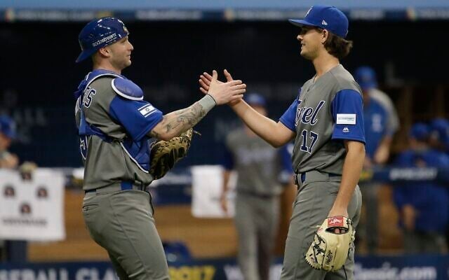 Israel's pitcher Dean Kremer, right, celebrates his team's victory with catcher Nick Rickles against Taiwan after the first round game of the World Baseball Classic at Gocheok Sky Dome in Seoul, South Korea, March 7, 2017. (AP Photo/Ahn Young-joon) Israel's pitcher Dean Kremer, right, celebrates his team's victory with catcher Nick Rickles against Taiwan after the first round game of the World Baseball Classic at Gocheok Sky Dome in Seoul, South Korea, March 7, 2017. (AP Photo/Ahn Young-joon)