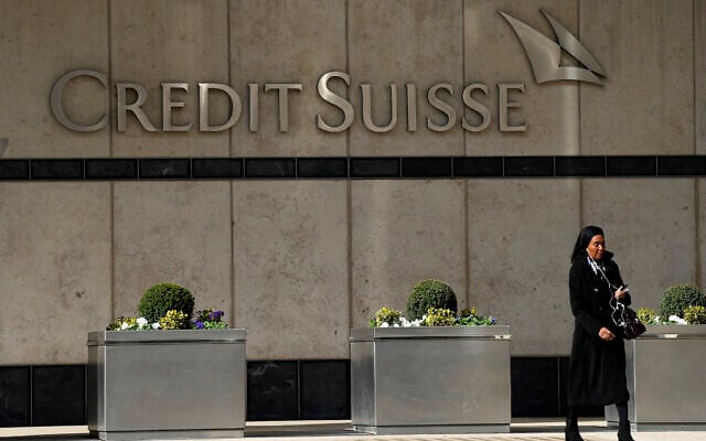 A woman walks past the Credit Suisse bank headquarters in London, Thursday, March 16, 2023.(AP Photo/Frank Augstein) A woman walks past the Credit Suisse bank headquarters in London, Thursday, March 16, 2023.(AP Photo/Frank Augstein)