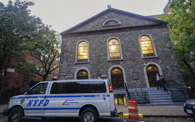 A New York City Police Department vehicle is parked outside a synagogue on the Lower East Side of Manhattan, October 7, 2023, in New York. (AP Photo/Mary Altaffer)