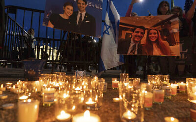 People gather to light candles in a makeshift memorial to honor Israeli Embassy staffers Yaron Lischinsky and Sarah Milgrim who were killed as they left an event at the Capital Jewish Museum in Washington, during a candlelight vigil outside of the White House in Washington, May 22, 2025. (AP Photo/Jose Luis Magana, file)