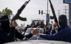 Members of the al-Qassam Brigades, the armed wing of Hamas, take part in a parade as they celebrate a ceasefire agreement between Hamas and Israel in Deir al-Balah, Gaza Strip, on January 19, 2025. (AP Photo/Abdel Kareem Hana, File)