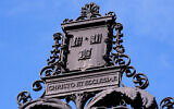 The Harvard University logo is displayed on a metal gate leading to Harvard Yard at Harvard University, September 30, 2025, in Cambridge, Massachusetts. (AP Photo/Charles Krupa)