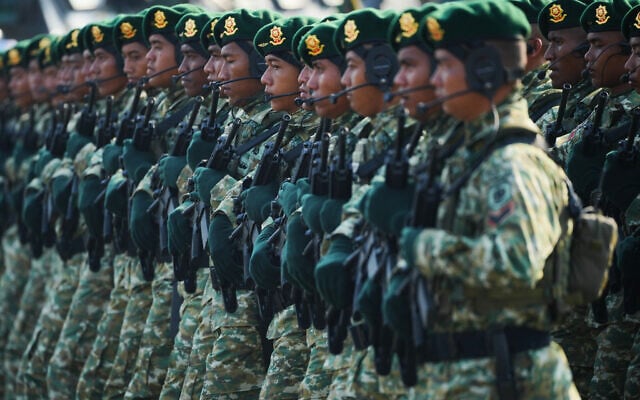 Indonesian soldiers of the Army Strategic Reserve Command march during a ceremony commemorating the 80th anniversary of the Indonesian Armed Forces in Jakarta, Indonesia, October 5, 2025. (Tatan Syuflana/AP)