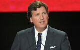 Tucker Carlson speaks at a memorial for Charlie Kirk, September 21, 2025, in Glendale, Arizona. (AP Photo/Ross D. Franklin, File)
