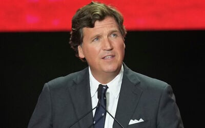 Tucker Carlson speaks at a memorial for Charlie Kirk, September 21, 2025, in Glendale, Arizona. (AP Photo/Ross D. Franklin, File)