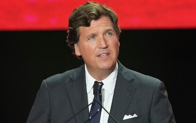 FILE - Tucker Carlson speaks at a memorial for Charlie Kirk, September 21, 2025, in Glendale, Arizona. (AP Photo/Ross D. Franklin, File) FILE - Tucker Carlson speaks at a memorial for Charlie Kirk, September 21, 2025, in Glendale, Arizona. (AP Photo/Ross D. Franklin, File)