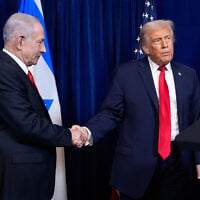 US President Donald Trump (R) shakes hands with Prime Minister Benjamin Netanyahu as Trump listens to a question from a reporter at the end of a news conference at Mar-a-Lago, on December 29, 2025, in Palm Beach, Florida. (AP Photo/Alex Brandon/File)