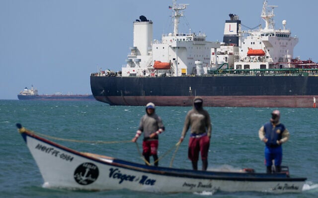 Fishermen pass an oil tanker in the Gulf of Venezuela off the shore of Punta Cardon, Venezuela, Jan. 14, 2026. (AP/Matias Delacroix) Fishermen pass an oil tanker in the Gulf of Venezuela off the shore of Punta Cardon, Venezuela, Jan. 14, 2026. (AP/Matias Delacroix)