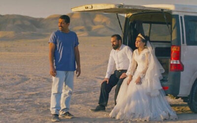 This image released by Neon shows, from left, Mohamad Ali Elyasmehr as Hamid, Majid Panahi as Ali, Hadis Pakbaten as Goli, in a scene from "It Was Just an Accident." (Neon via AP)