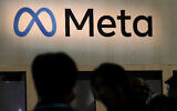 Attendees visit the Meta booth at the Game Developers Conference 2023 in San Francisco, California, on March 22, 2023. (AP Photo/Jeff Chiu)