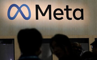 Attendees visit the Meta booth at the Game Developers Conference 2023 in San Francisco, California, on March 22, 2023. (AP Photo/Jeff Chiu)