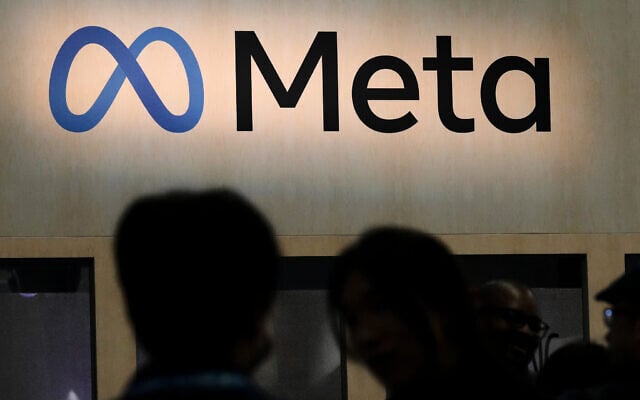 Attendees visit the Meta booth at the Game Developers Conference 2023 in San Francisco, California, on March 22, 2023. (AP Photo/Jeff Chiu)