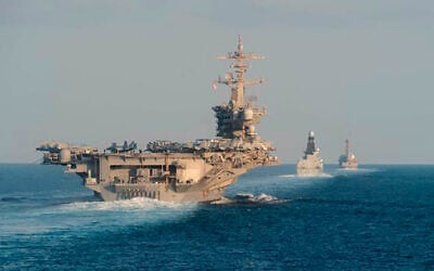 The aircraft carrier USS Abraham Lincoln, left, the air-defense destroyer HMS Defender and the guided-missile destroyer USS Farragut transit the Strait of Hormuz with the guided-missile cruiser USS Leyte Gulf, November 19, 2019. (Mass Communication Specialist 3rd Class Zachary Pearson/U.S. Navy via AP, File) The aircraft carrier USS Abraham Lincoln, left, the air-defense destroyer HMS Defender and the guided-missile destroyer USS Farragut transit the Strait of Hormuz with the guided-missile cruiser USS Leyte Gulf, November 19, 2019. (Mass Communication Specialist 3rd Class Zachary Pearson/U.S. Navy via AP, File)