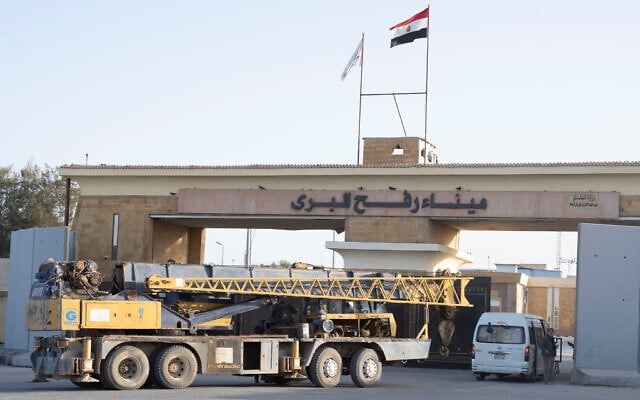 A crane enters the Egyptian gate of the Rafah Crossing to the Gaza Strip, in Rafah, Egypt, February 1, 2026. (AP Photo/Mohamed Arafat) A crane enters the Egyptian gate of the Rafah Crossing to the Gaza Strip, in Rafah, Egypt, February 1, 2026. (AP Photo/Mohamed Arafat)