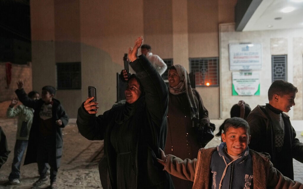 People wave to returnees as they arrive in a bus at Nasser Hospital after a group of 40 Palestinians was allowed into Gaza from Egypt following the reopening of the Rafah Border Crossing in Khan Younis, southern Gaza Strip, early February 4, 2026. (AP/Jehad Alshrafi) People wave to returnees as they arrive in a bus at Nasser Hospital after a group of 40 Palestinians was allowed into Gaza from Egypt following the reopening of the Rafah Border Crossing in Khan Younis, southern Gaza Strip, early February 4, 2026. (AP/Jehad Alshrafi)
