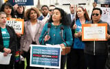 Analilia Mejia, center, speaks during a rally calling for US Supreme Court ethics reform, May 2, 2023, in Washington. (Joy Asico/AP Images for Center for Popular Democracy Action)