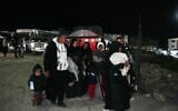 Palestinians are welcomed by relatives after they enter Gaza from Egypt following the long-awaited reopening of the Rafah border crossing, in Khan Younis, southern Gaza Strip, February 5, 2026. (AP Photo/Abdel Kareem Hana)